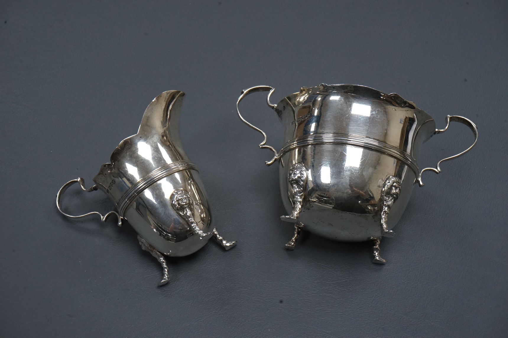 An Edwardian silver two handled sugar bowl and matching cream jug, by John Milward Banks, Chester, 1908, 13.6oz.